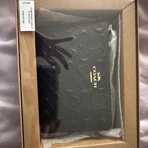 Coach small black wristlet with charms